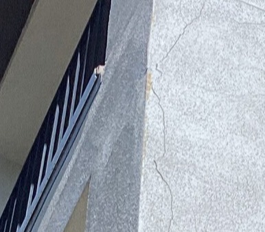 Porch stucco crack damage