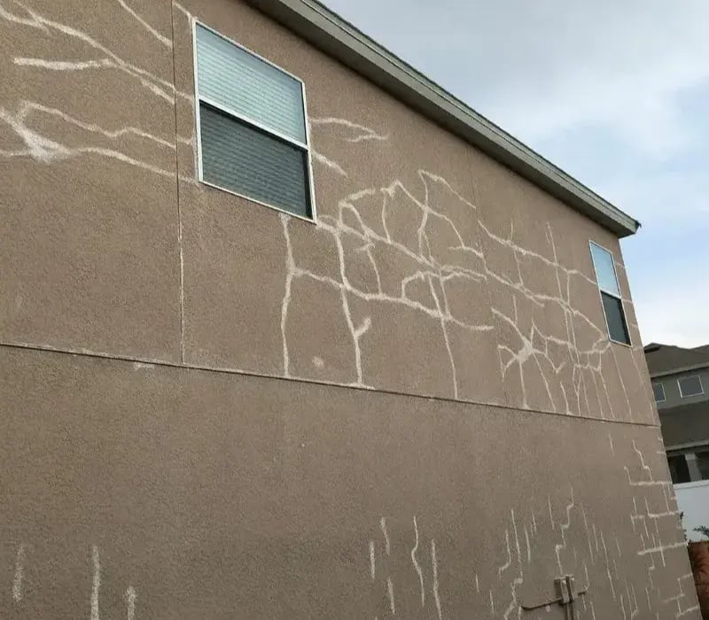 Stucco cracks entire wall